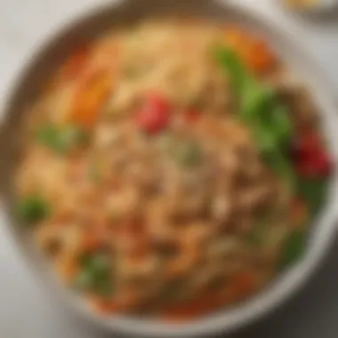 Artfully Presented Peanut Sauce Noodles with Vegetables A beautifully arranged plate of peanut sauce noodles paired with colorful vegetables