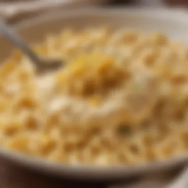 A close-up of creamy cheese sauce coating perfectly cooked pasta