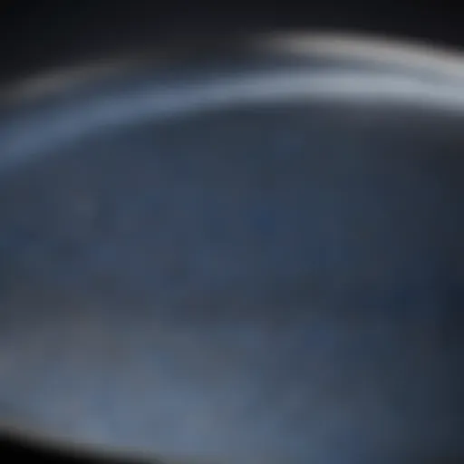 Close-up view of a blue carbon steel pan showing its distinctive surface texture