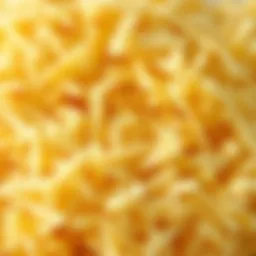 A close-up of shredded parmesan cheese showcasing its texture and color.