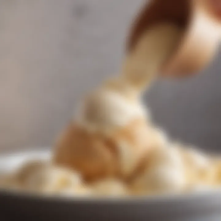 Scooping ice cream from a tub with a stylish scoop