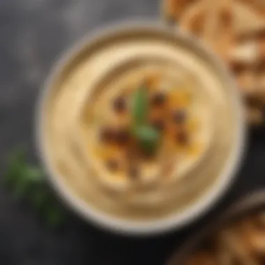 Deliciously Smooth Hummus Bowl of smooth hummus with olive oil drizzle