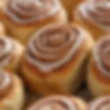 A close-up of freshly baked gluten-free cinnamon rolls showcasing their fluffy texture and rich glaze.