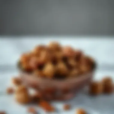 An elegant bowl filled with walnuts and pecans on a marble surface