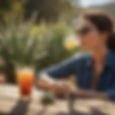 Enjoying Low Sugar Aloe Drink Outdoors A scenic outdoor setting with a person enjoying a low sugar aloe drink under the sun