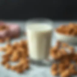 Almond milk in a glass surrounded by almonds