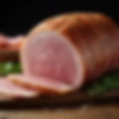 A close-up of high-quality deli sliced ham with herbs and spices