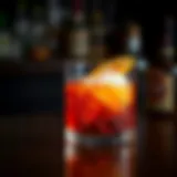 Classic Old Fashioned cocktail garnished with an orange twist