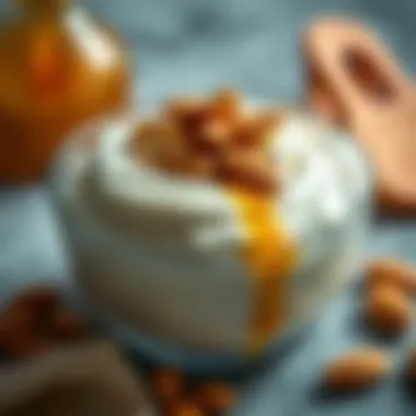 A bowl of creamy yogurt topped with sliced almonds and honey, showcasing a delightful breakfast option.
