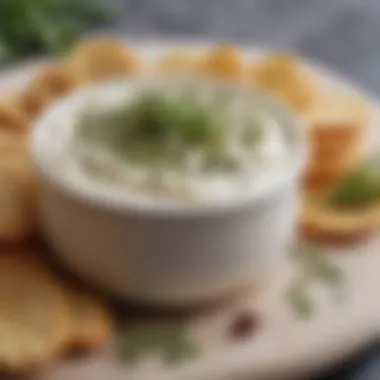 Close-up of creamy goat cheese dip garnished with herbs and spices, showcasing its luscious texture.