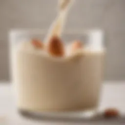 A close-up of evaporated almond milk in a glass, showcasing its creamy texture.