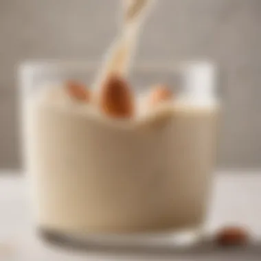 A close-up of evaporated almond milk in a glass, showcasing its creamy texture.