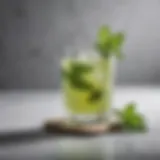 Elegant matcha vodka cocktail garnished with fresh mint leaves