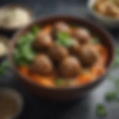 A vibrant bowl of Asian meatballs garnished with fresh herbs and sesame seeds