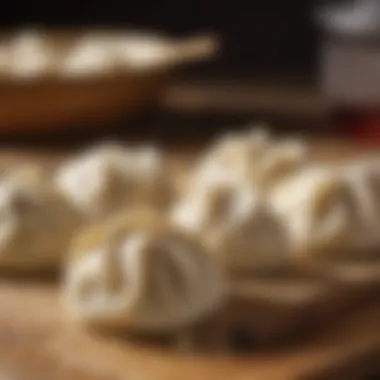 A close-up of freshly made dumpling dough resting on a wooden surface.