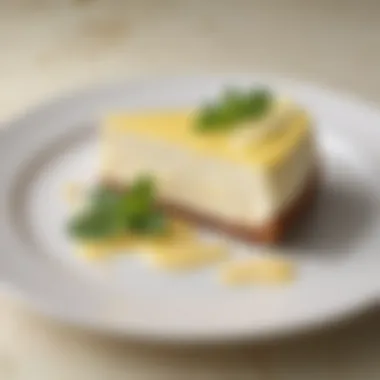 A beautifully plated slice of lemon cheesecake garnished with mint leaves