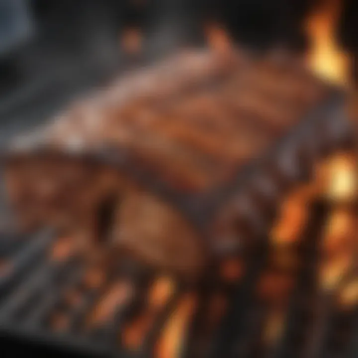 Charcoal grill with ribs sizzling over flames