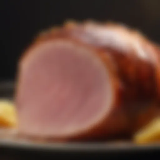 Close-up of a beautifully glazed ham with a shiny surface reflecting light