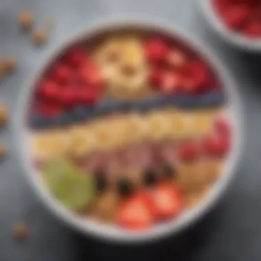 A close-up of a nutritious smoothie bowl topped with granola and fresh berries.