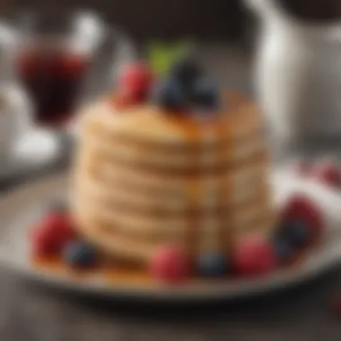 Fluffy pancakes served with maple syrup and berries