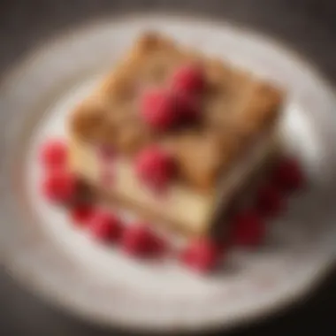 Artfully presented raspberry crumb cake on a decorative plate