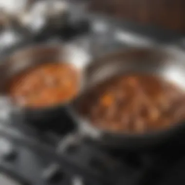 A side-by-side comparison of food sizzling in a stainless steel pan and a nonstick pan to demonstrate performance