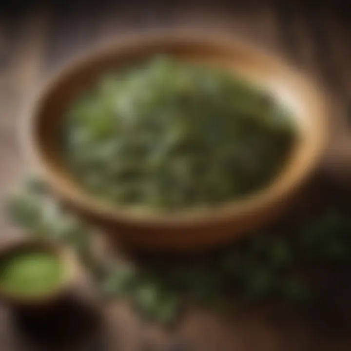 Delicate green tea leaves nestled in a wooden bowl