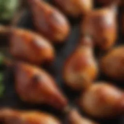 Close-up of succulent smoked chicken drumsticks glistening with glaze.
