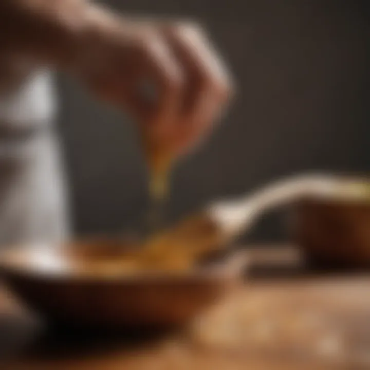 A close-up of a person maintaining a wooden scraping spoon with oil and cloth