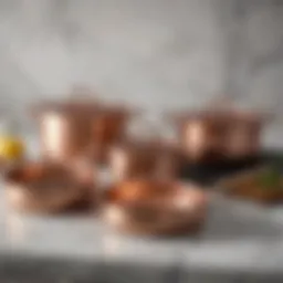 Elegant copper cookware set displayed on a marble countertop