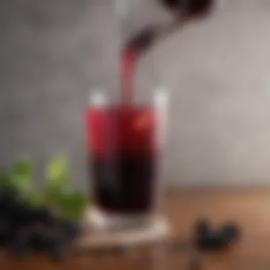 Elderberry syrup pouring into a glass