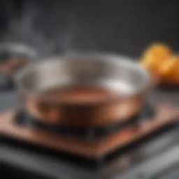 Close-up of All-Clad Copper Core cookware on an induction cooktop showcasing thermal performance